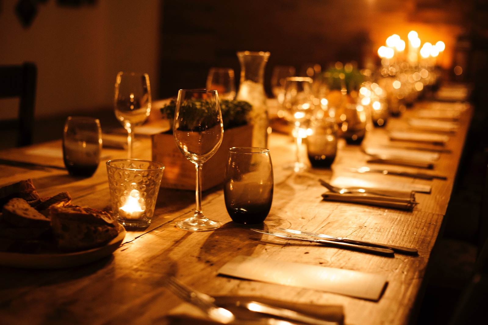 A warmly set dinner table ready for guests